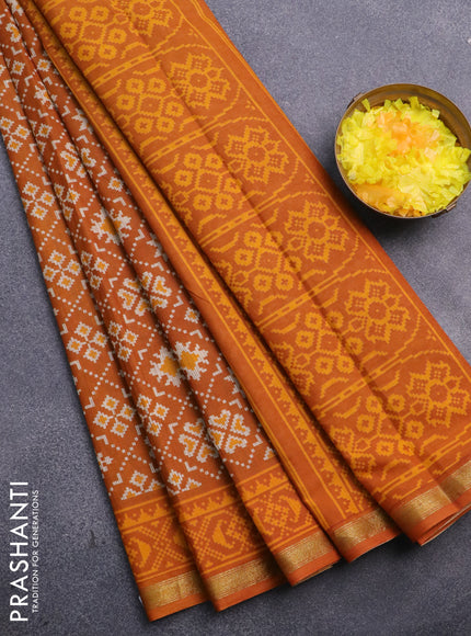 Muslin cotton saree dark mustard with allover ikat prints and small zari woven border