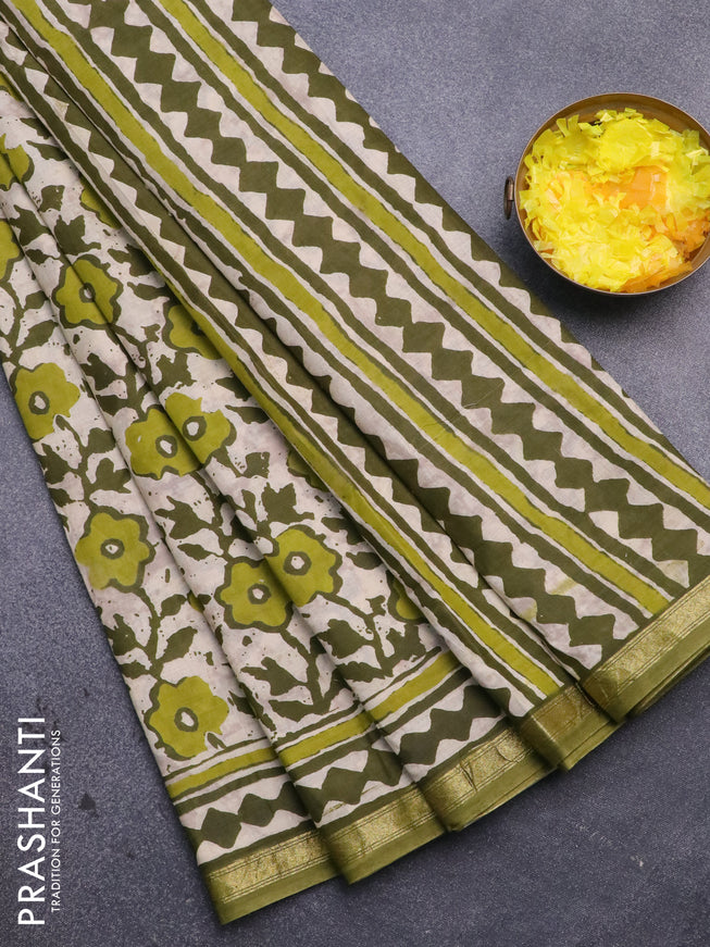 Muslin cotton saree cream and sap green with allover prints and small zari woven border