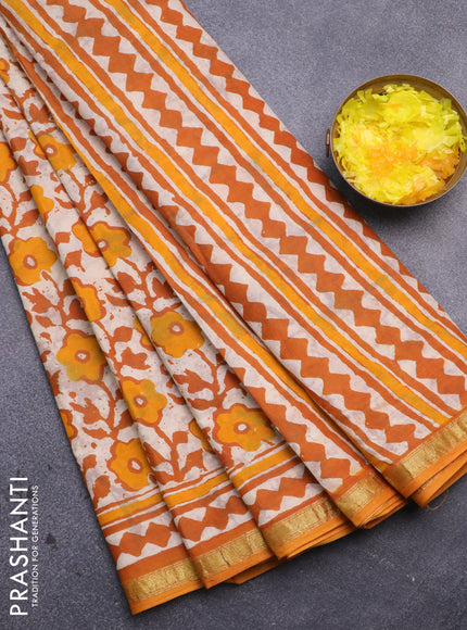 Muslin cotton saree cream and mango yellow with allover prints and small zari woven border