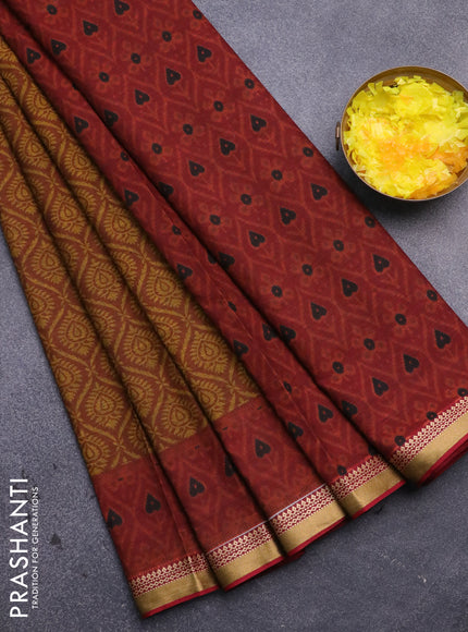 Muslin cotton saree dark mustard and maroon with allover prints and thread woven border