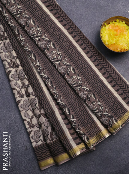 Muslin cotton saree beige and grey with allover prints and small zari woven border