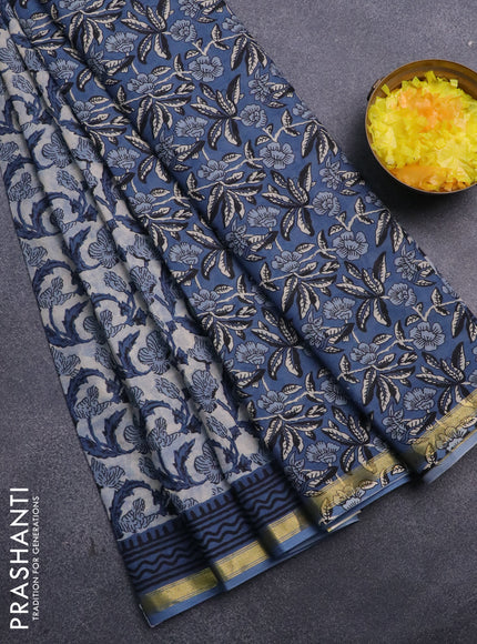 Muslin cotton saree cream and blue with allover prints and small zari woven border