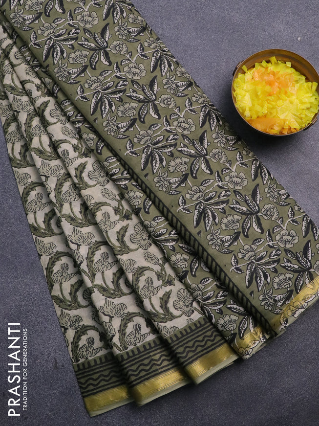 Muslin cotton saree cream and green with allover prints and small zari woven border