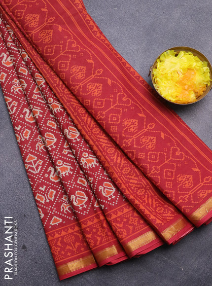 Muslin cotton saree red with allover patola prints and small zari woven border