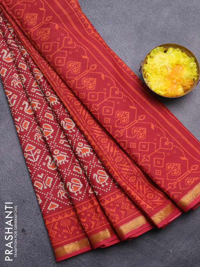 Muslin cotton saree red with allover patola prints and small zari woven border