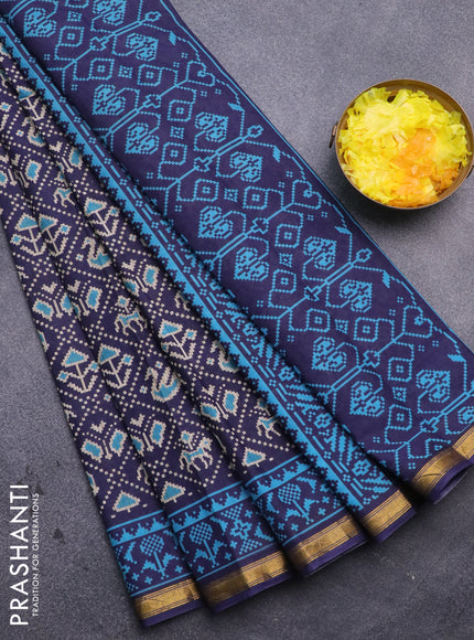 Muslin cotton saree blue with allover patola prints and small zari woven border