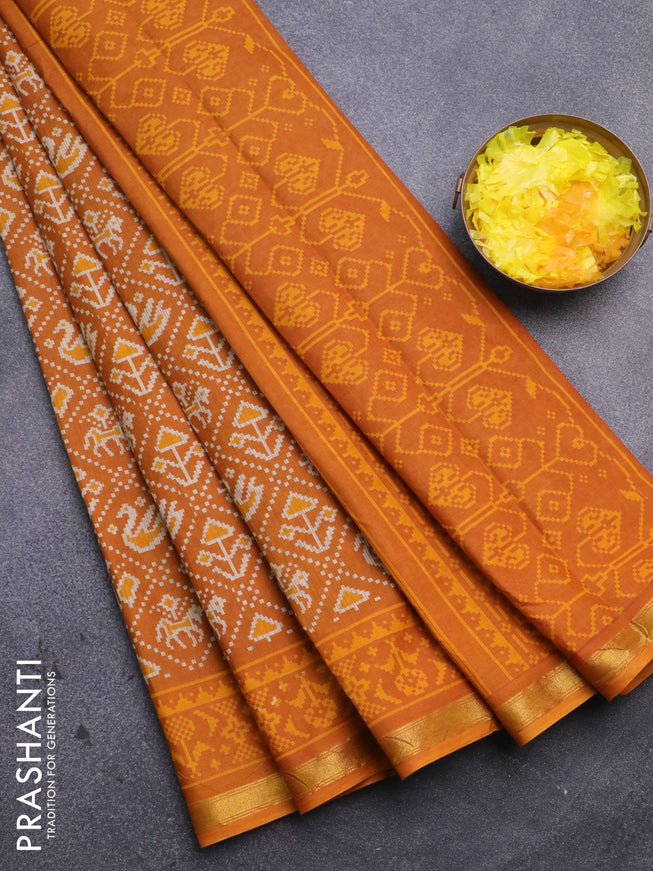 Muslin cotton saree mustard yellow with allover patola prints and small zari woven border