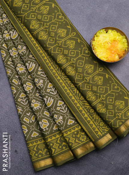 Muslin cotton saree sap green with allover patola prints and small zari woven border