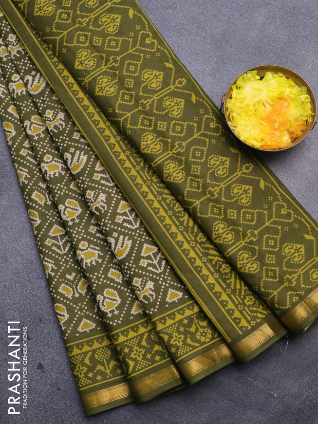 Muslin cotton saree sap green with allover patola prints and small zari woven border