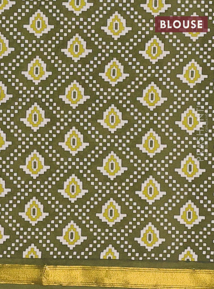 Muslin cotton saree sap green with allover patola prints and small zari woven border