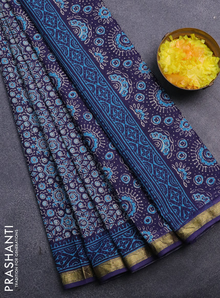 Muslin cotton saree blue with allover ajrakh prints and small zari woven border