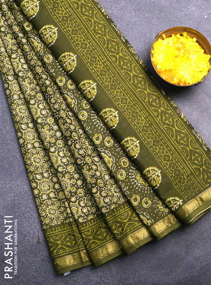 Muslin cotton saree sap green with allover ajrakh prints and small zari woven border