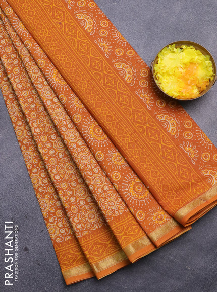 Muslin cotton saree mustard yellow with allover ajrakh prints and small zari woven border