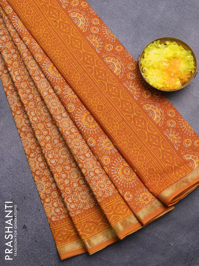 Muslin cotton saree mustard yellow with allover ajrakh prints and small zari woven border