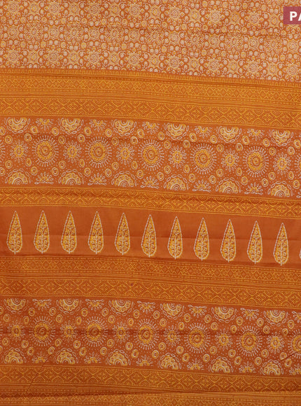 Muslin cotton saree mustard yellow with allover ajrakh prints and small zari woven border