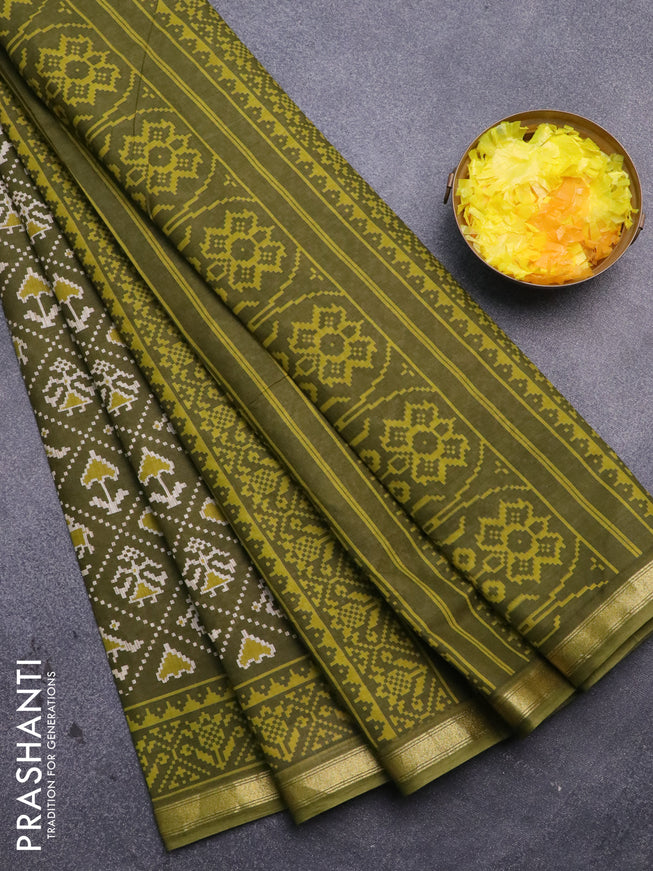 Muslin cotton saree sap green with allover patola prints and small zari woven border