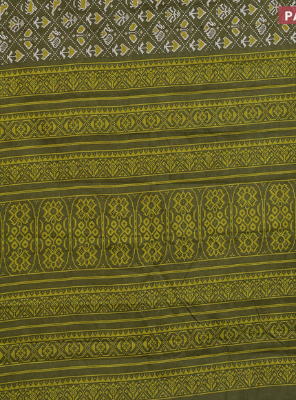 Muslin cotton saree sap green with allover patola prints and small zari woven border