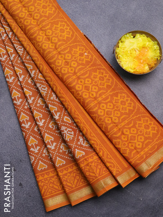 Muslin cotton saree mustard yellow with allover patola prints and small zari woven border