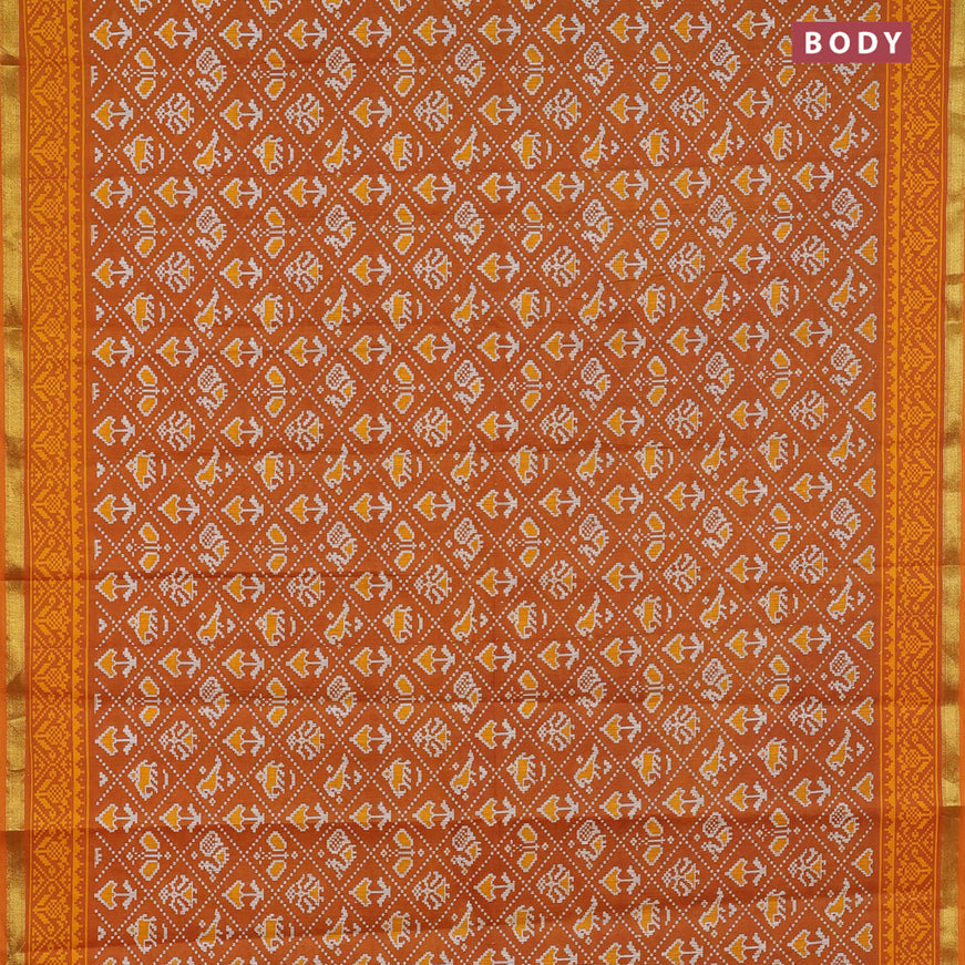 Muslin cotton saree mustard yellow with allover patola prints and small zari woven border