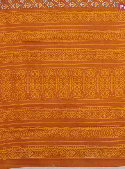 Muslin cotton saree mustard yellow with allover patola prints and small zari woven border