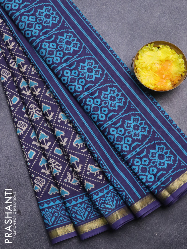 Muslin cotton saree blue with allover patola prints and small zari woven border