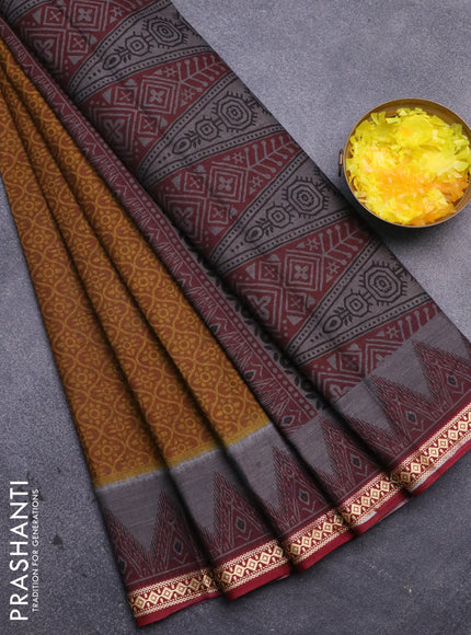 Muslin cotton saree mustard yellow and maroon with allover prints and thread woven border