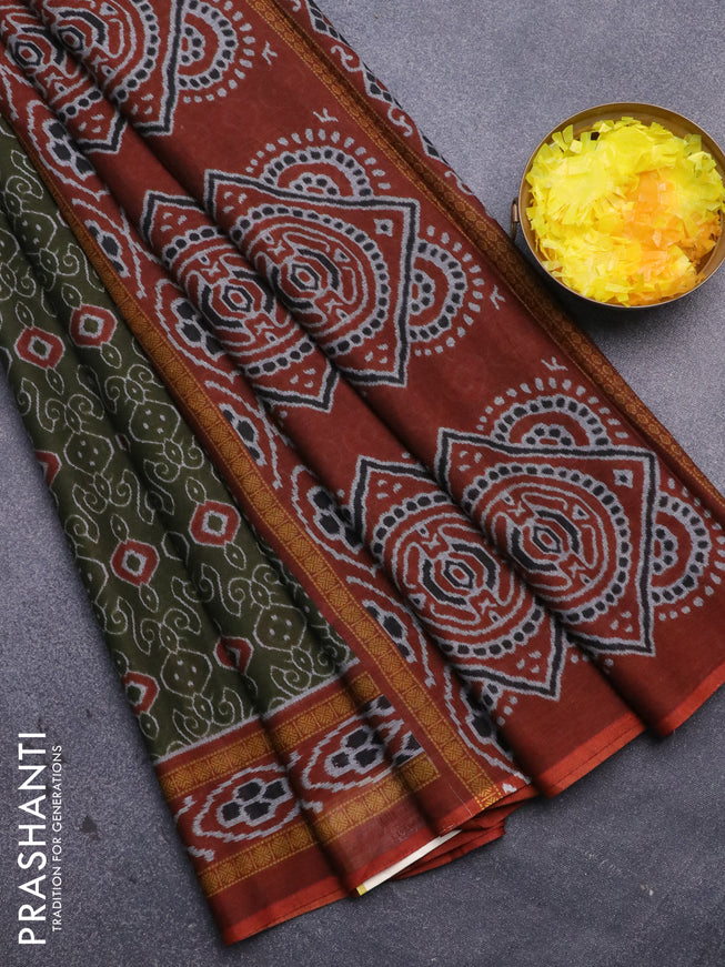 Muslin cotton saree sap green and rust shade with allover prints and printed border