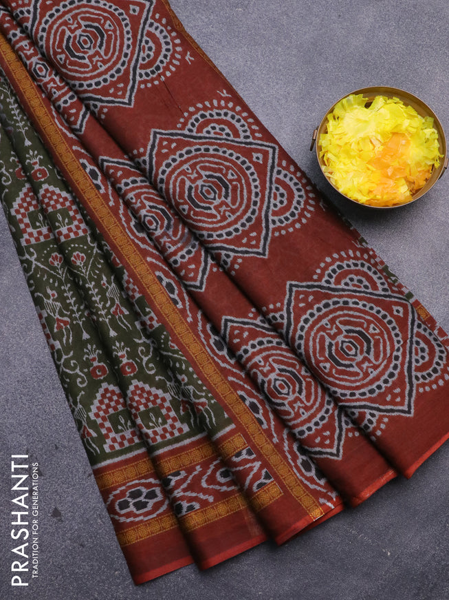 Muslin cotton saree sap green and rust shade with allover ikat prints and printed border