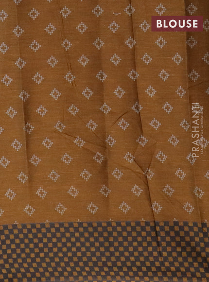 Muslin cotton saree grey and mustard shade with allover ikat prints and printed border