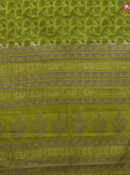 Muslin cotton saree light green and brown with allover prints and small zari woven border