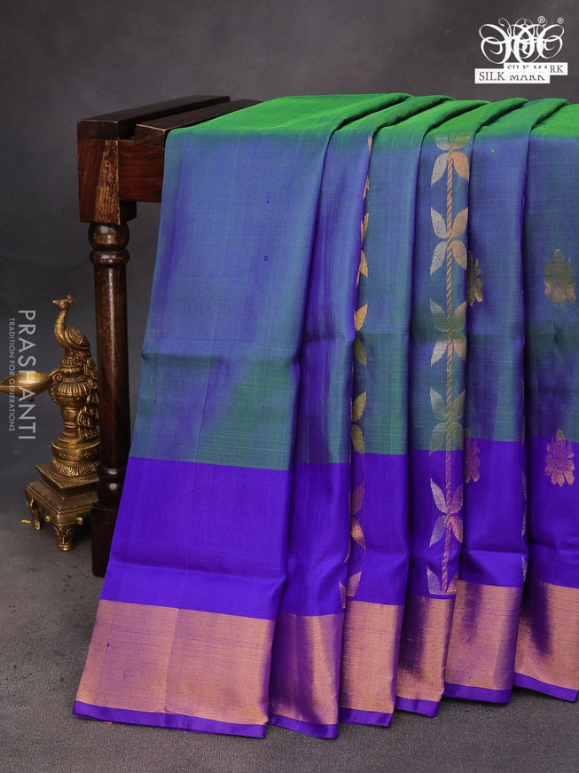 Pure uppada silk saree dual shade of bluish green and blue with allover zari weaves and zari woven border