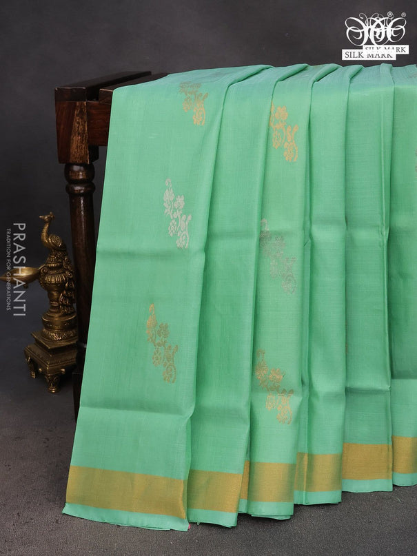 Pure uppada silk saree teal green shade with zari woven floral buttas and zari woven border