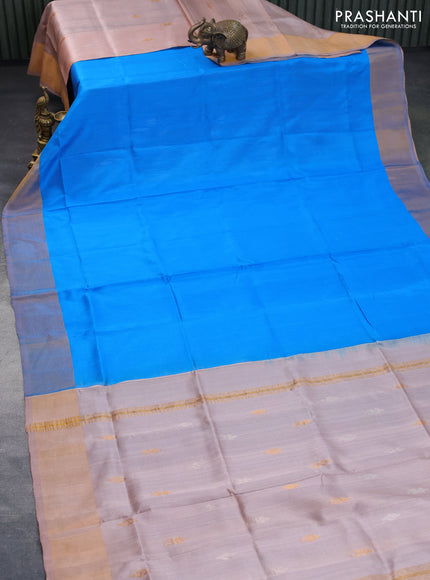 Pure uppada partly silk saree cs blue and pastel brown with plain body and zari woven border