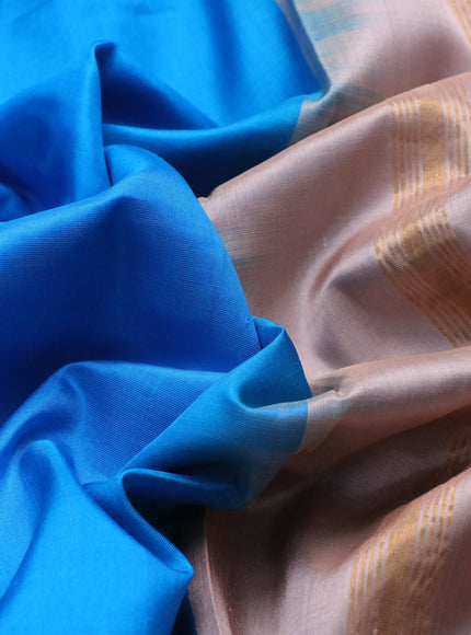 Pure uppada partly silk saree cs blue and pastel brown with plain body and zari woven border