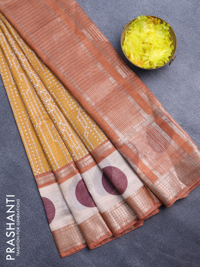 Assam silk saree mustard yellow and rust shade with allover zari checked pattern & prints and rettapet zari woven printed border