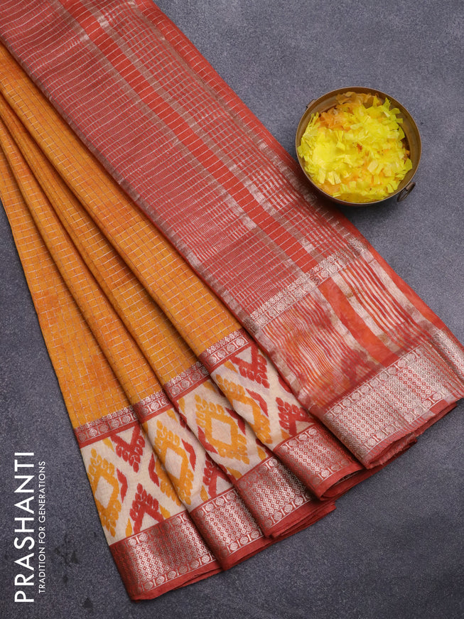 Assam silk saree mango yellow and rust shade with allover zari checked pattern and rettapet zari woven ikat printed border