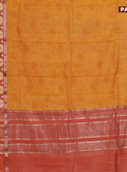 Assam silk saree mango yellow and rust shade with allover zari checked pattern and rettapet zari woven ikat printed border