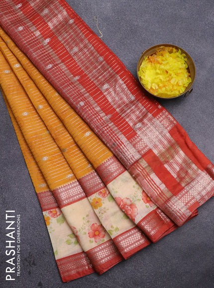 Assam silk saree mango yellow and rust shade with allover zari strips and rettapet zari woven floral printed border