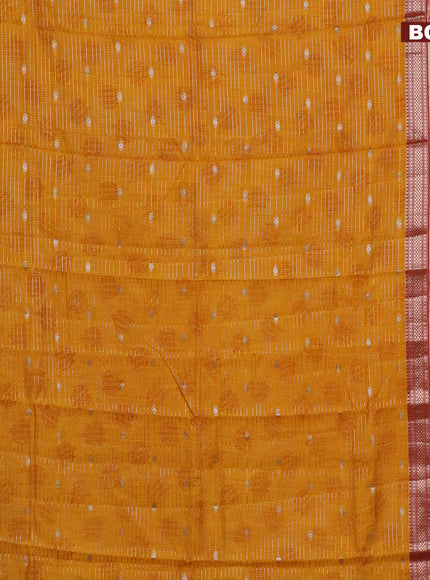 Assam silk saree mango yellow and rust shade with allover zari strips and rettapet zari woven floral printed border