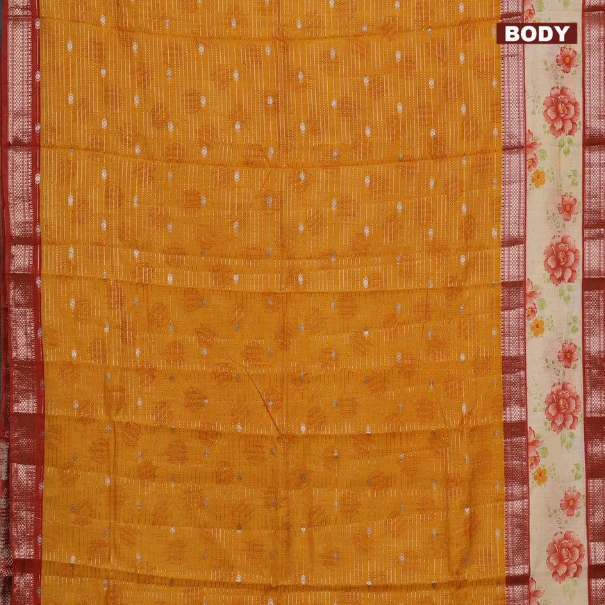 Assam silk saree mango yellow and rust shade with allover zari strips and rettapet zari woven floral printed border