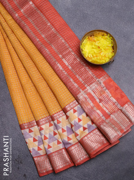 Assam silk saree mango yellow and rust shade with allover zari checked pattern and rettapet zari woven geometric printed border