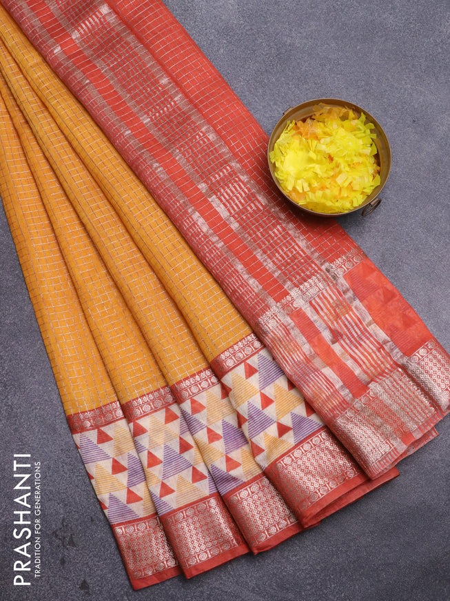 Assam silk saree mango yellow and rust shade with allover zari checked pattern and rettapet zari woven geometric printed border