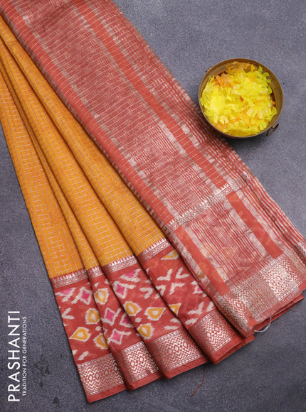 Assam silk saree mango yellow and rust shade with allover zari checked pattern and rettapet zari woven ikat printed border