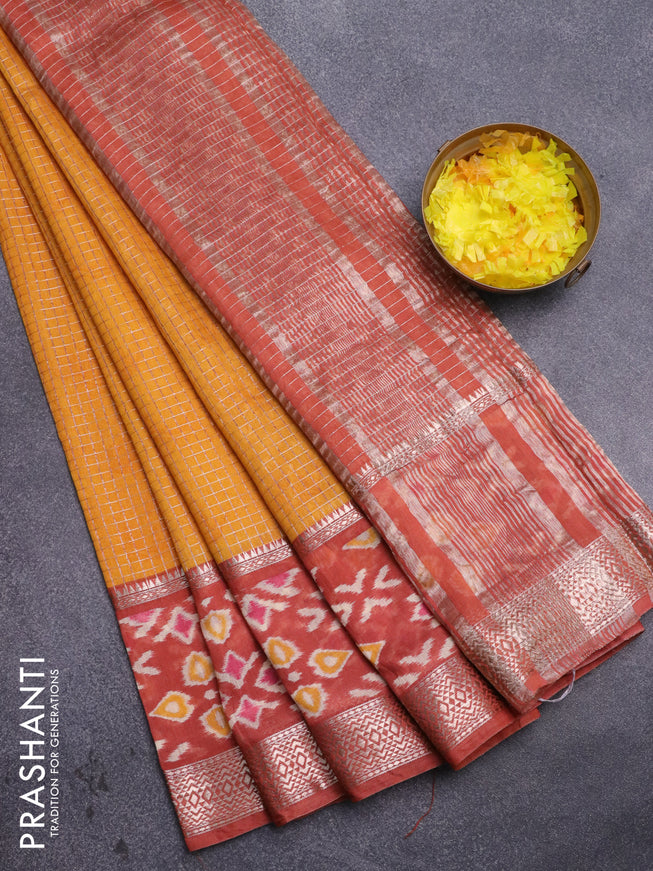 Assam silk saree mango yellow and rust shade with allover zari checked pattern and rettapet zari woven ikat printed border