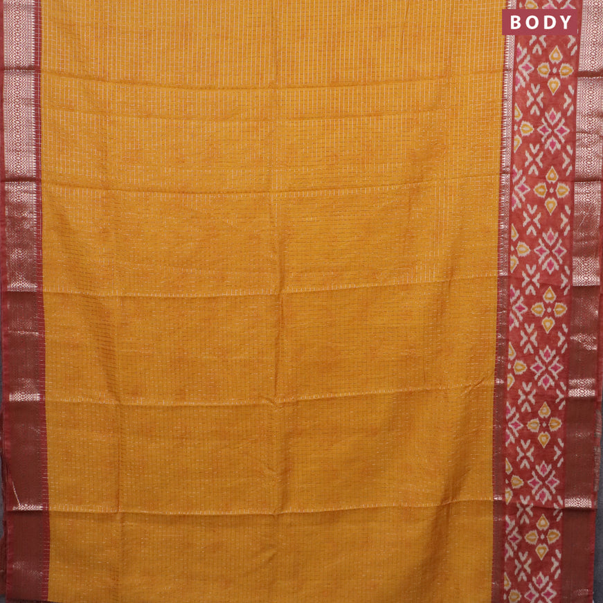 Assam silk saree mango yellow and rust shade with allover zari checked pattern and rettapet zari woven ikat printed border