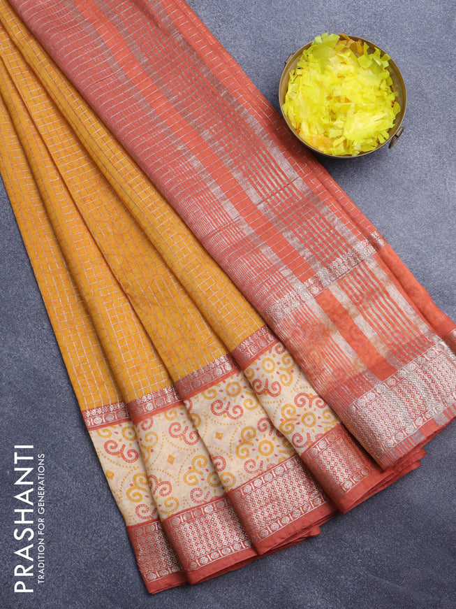 Assam silk saree mustard yellow and rust shade with allover zari checked pattern and rettapet zari woven printed border