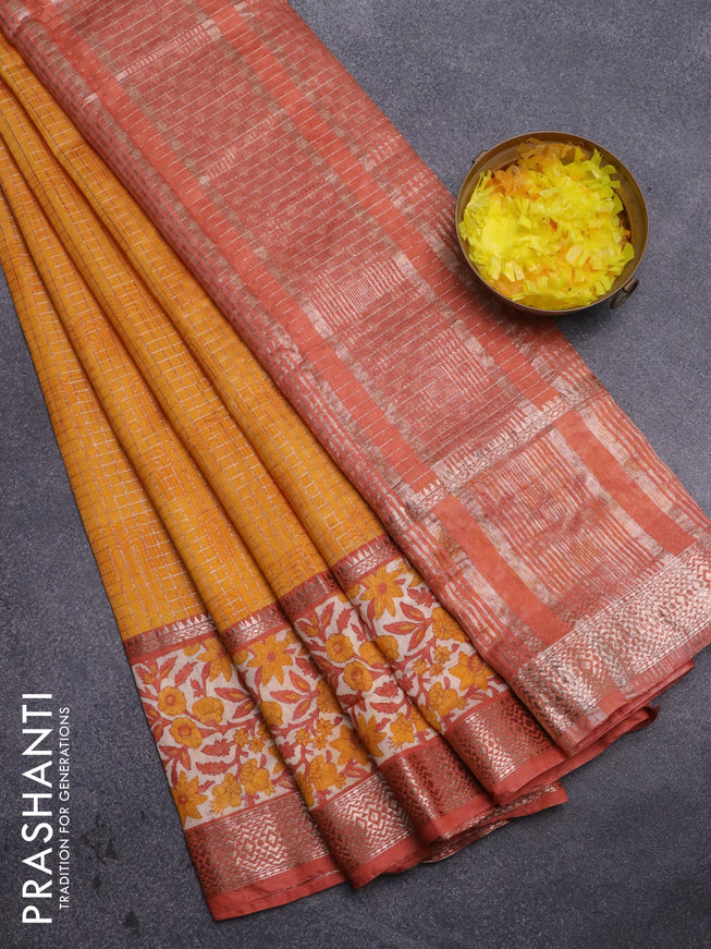 Assam silk saree mango yellow and rust shade with allover zari checked pattern and rettapet zari woven floral printed border