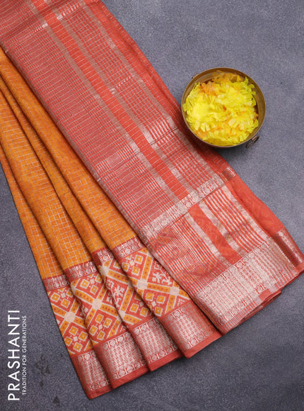 Assam silk saree mango yellow and rust shade with allover zari checked pattern and rettapet zari woven ikat printed border