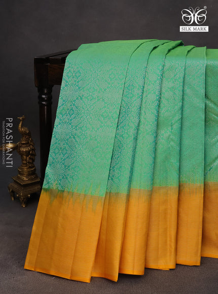 Pure soft silk saree dual shade of teal green and mango yellow with allover silver zari woven brocade weaves and rich silver zari woven border