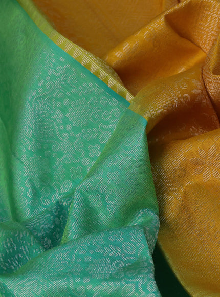 Pure soft silk saree dual shade of teal green and mango yellow with allover silver zari woven brocade weaves and rich silver zari woven border